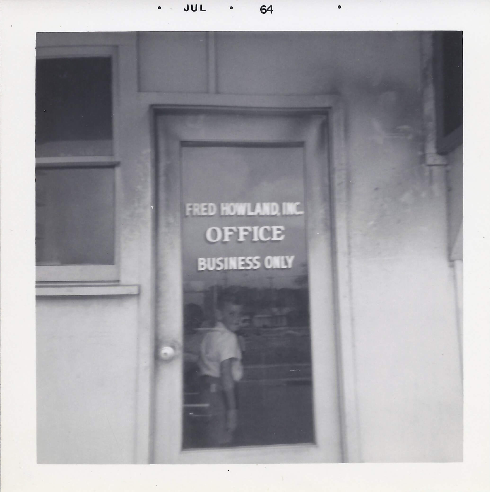 A door to an office with the words " no smoking in office business only ".