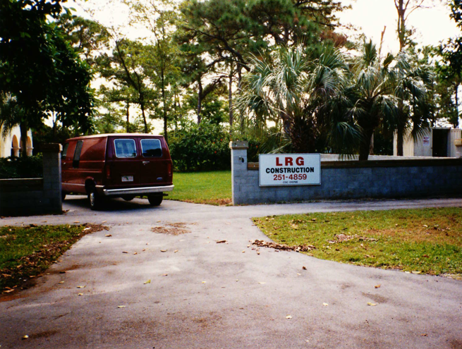 A van parked in front of a building.